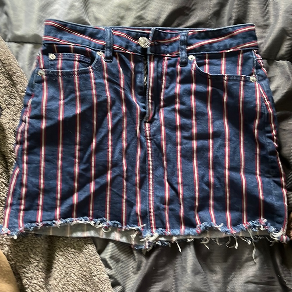 Super stretch size 4 American Eagle denim skirt. With red and white stripes